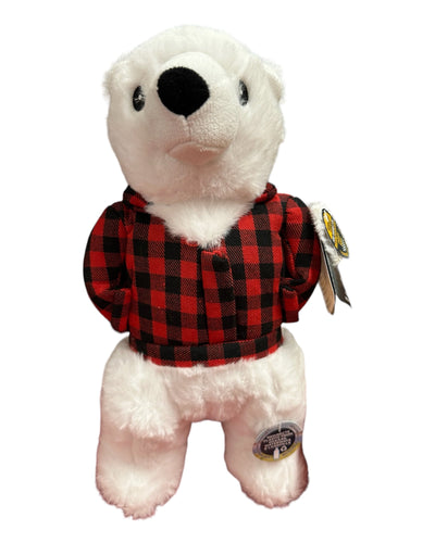 Stuffed toy white polar bear wearing a black and red plaid shirt