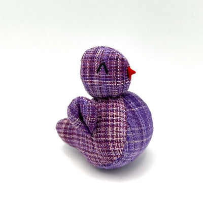 Purple stuffed chicken toy